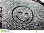 smiley-face-drawn-snow-covered-glass-66095164.jpg